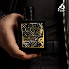 Lattafa bottle on dresser in lifestyle scene suggesting daily style benefit: elegant display