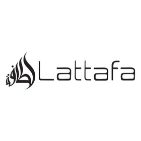 Lattafa Qimmah on vanity in evening setting showing warm, sophisticated mood