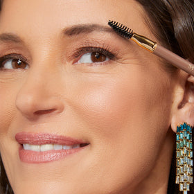 LAURA GELLER pencil held in hand showing compact size and portability