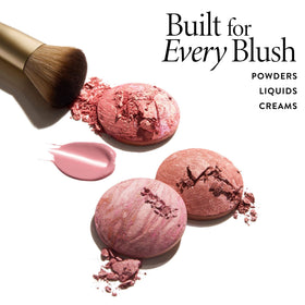 LAURA GELLER NEW YORK brush in use applying blush for natural blended finish
