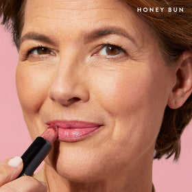 LAURA GELLER applying Honey Bun on lips for natural, fuller-looking color