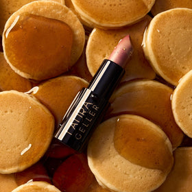 LAURA GELLER ingredient highlight with Vitamin E and castor seed oil indicating moisture benefits