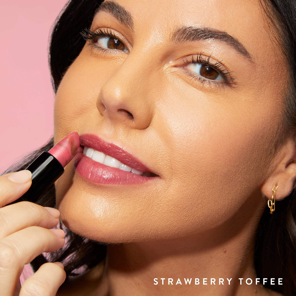 LAURA GELLER NEW YORK swatch on forearm illustrating Strawberry Toffee creamy rose-pink payoff