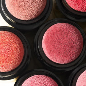 LAURA GELLER lifestyle model wearing coral showing fresh, everyday radiance benefit