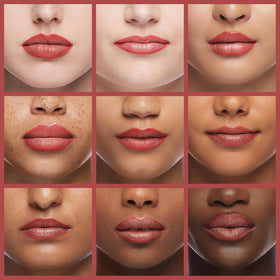 LAURA GELLER NEW YORK lip liner held in hand to show pencil scale and travel-friendly size