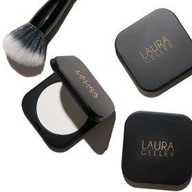 LAURA GELLER NEW YORK powder next to fingers illustrating compact size and portability