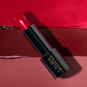 LAURA GELLER NEW YORK lipstick inside a purse showing on-the-go touch-up practicality