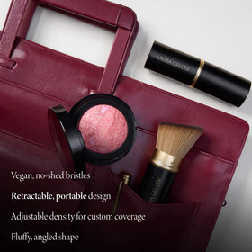 LAURA GELLER NEW YORK using brush to buff liquid foundation for seamless finish