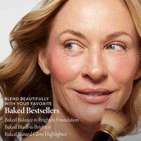 LAURA GELLER NEW YORK blending powder with kabuki for even, streak-free coverage
