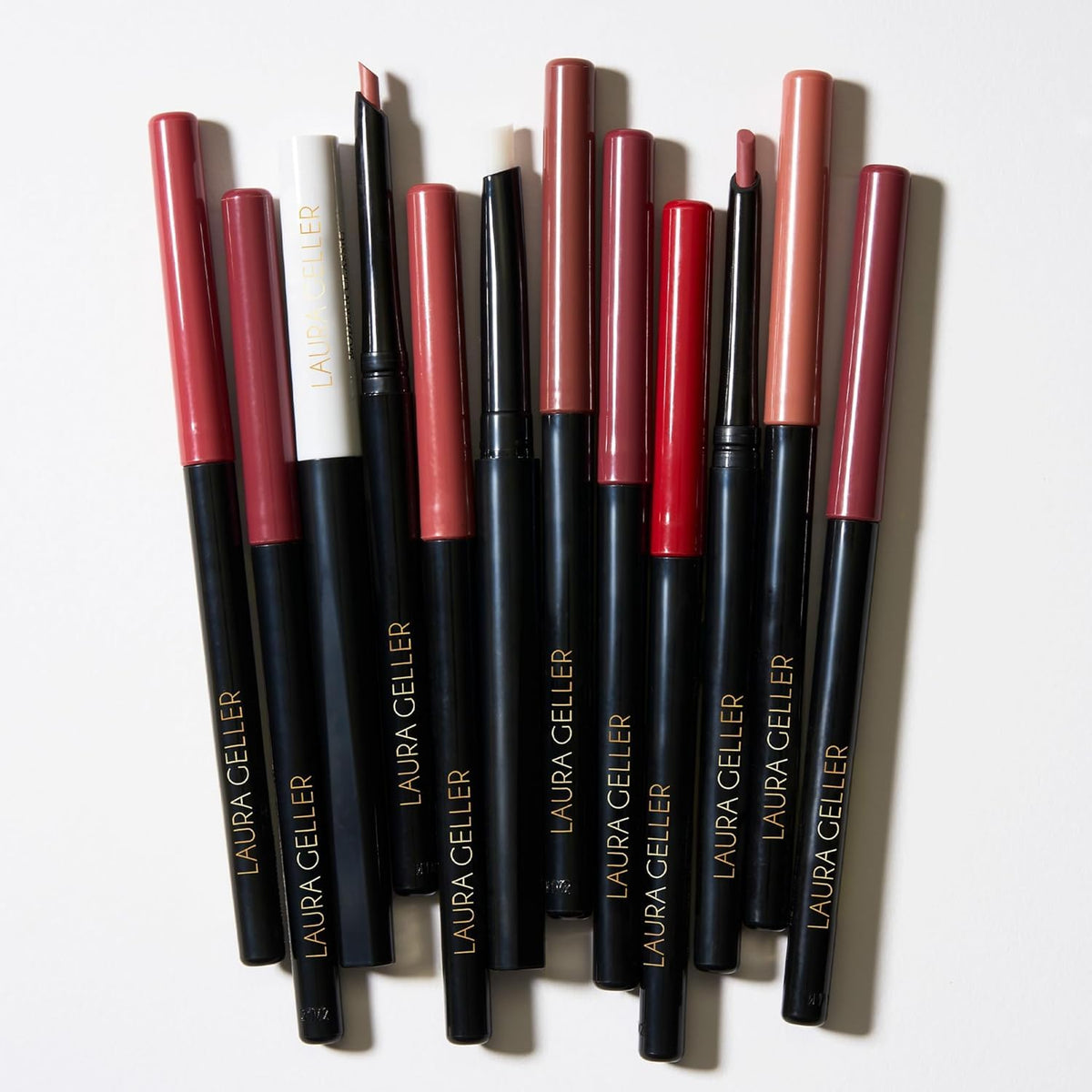 LAURA GELLER NEW YORK clear liner beside lipstick to preserve color