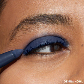 LAURA GELLER NEW YORK denim swatch on arm showing rich pigment benefit: true-to-color payoff
