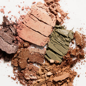 LAURA GELLER NEW YORK palette beside everyday items to show compact size advantage