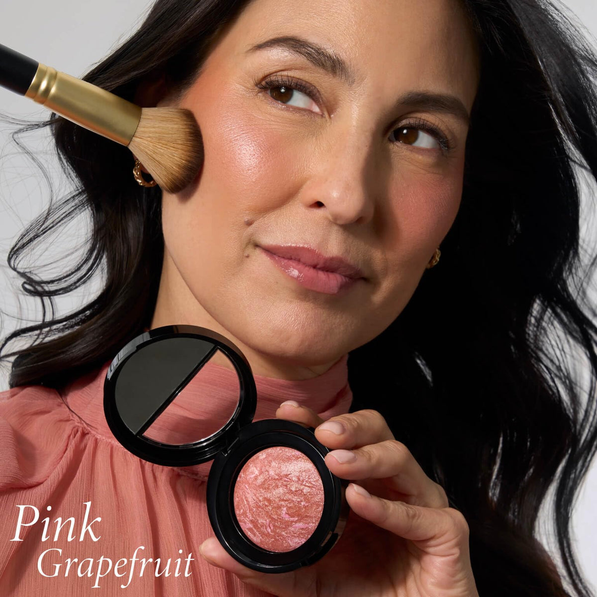 LAURA GELLER cheek swatch of Pink Grapefruit showing natural buildable color