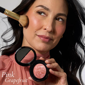 LAURA GELLER cheek swatch of Pink Grapefruit showing natural buildable color