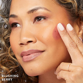 LAURA GELLER NEW YORK blush applied on cheeks in daylight for natural luminous finish