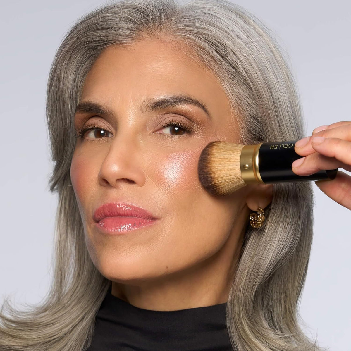 LAURA GELLER NEW YORK palette inside a travel makeup bag for on-the-go convenience