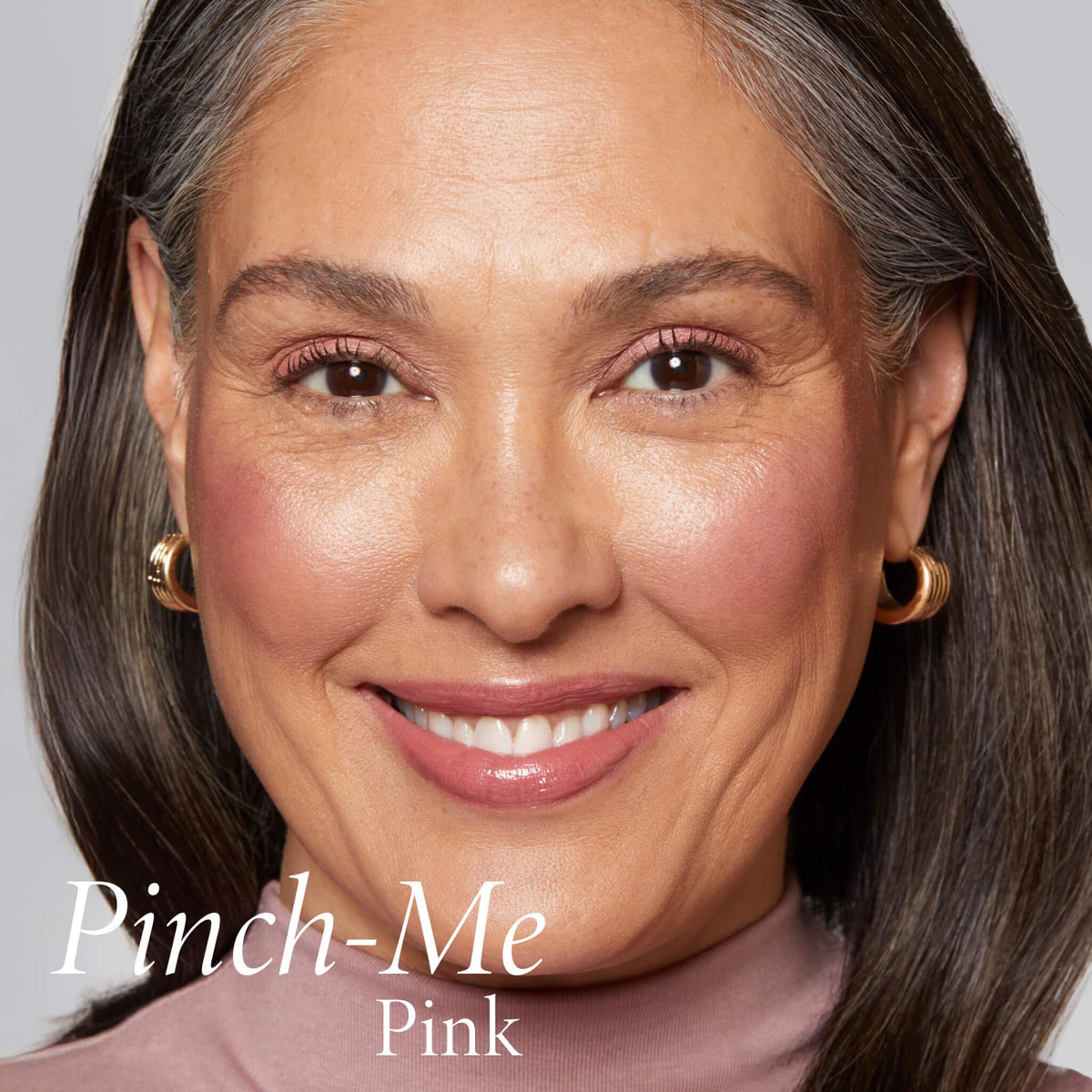 LAURA GELLER applied on cheek showing natural dewy flush and hydration