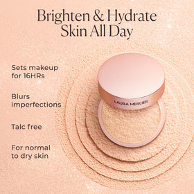 Laura Mercier brush picking up powder demonstrating effortless application and control