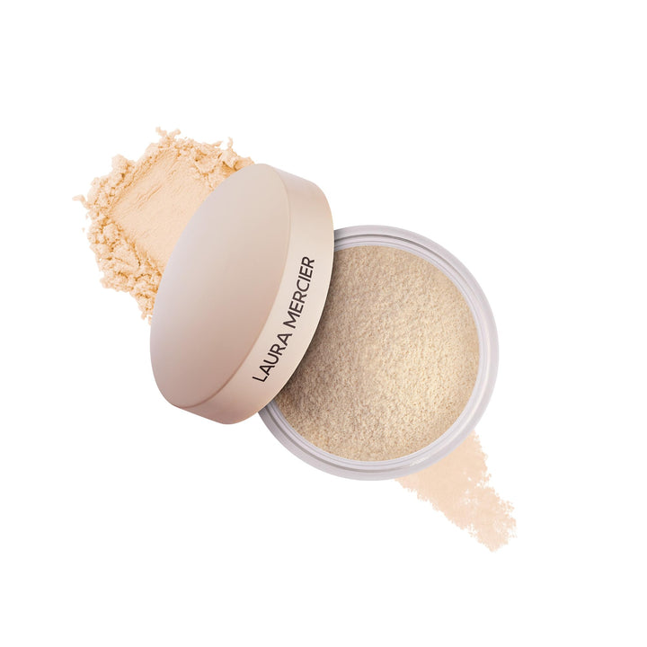 Laura Mercier mini jar front view showing compact translucent powder benefit