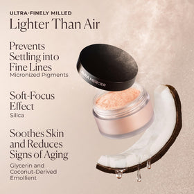 Laura Mercier concealer and powder swatch showing blended result and crease control benefit