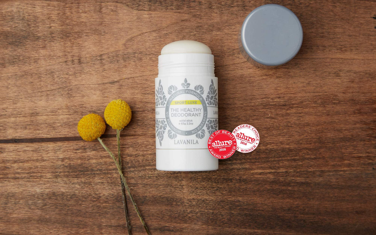 Lavanila packaging staged with eco props showing planet-friendly benefit