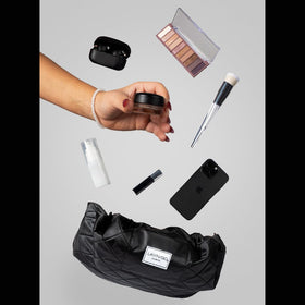 Lay-n-Go Cosmo packed inside a suitcase for tidy travel organization