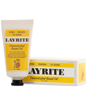 Layrite beard oil in hand being applied to beard for smoother, softer facial hair