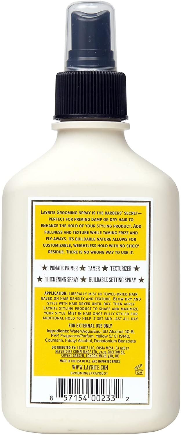 Layrite grooming spray in hand to show 6.7 oz scale and travel‑friendly convenience