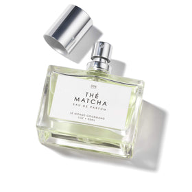 Le Monde Gourmand bottle close-up focusing on glass and atomizer for premium feel