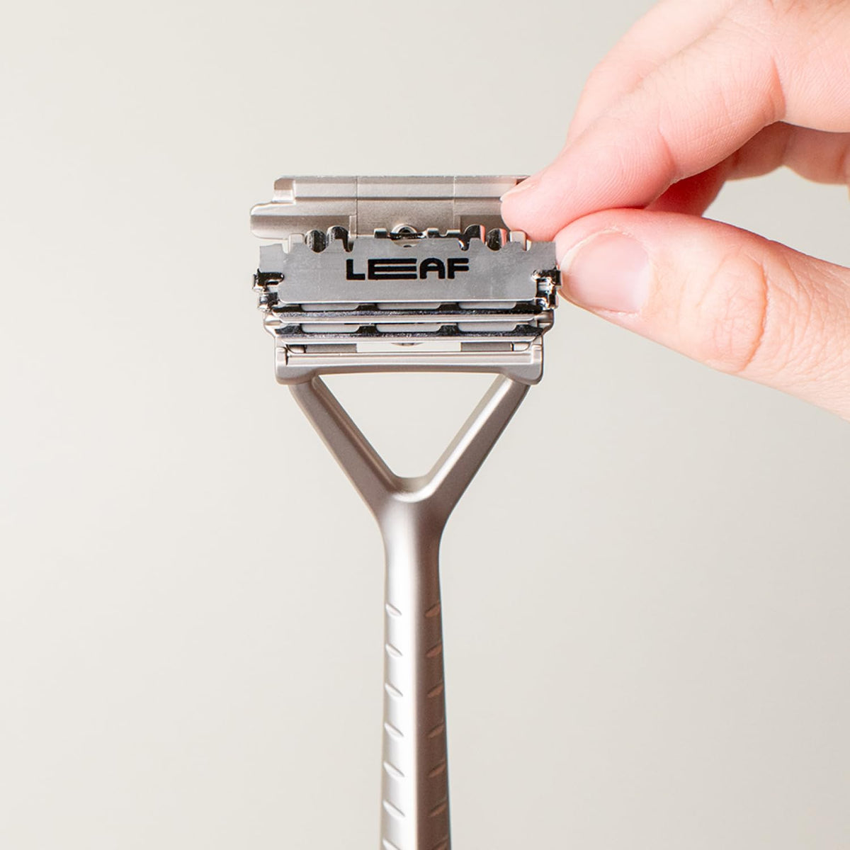 Leaf Shave blade installed in razor head demonstrating easy replacement and reliable fit