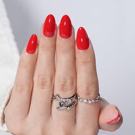 Leefrei model wearing Cherry Heat nails in lifestyle setting showcasing instant polish
