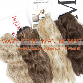 Hand holding LEEONS extensions to show 20-inch scale and true length benefit
