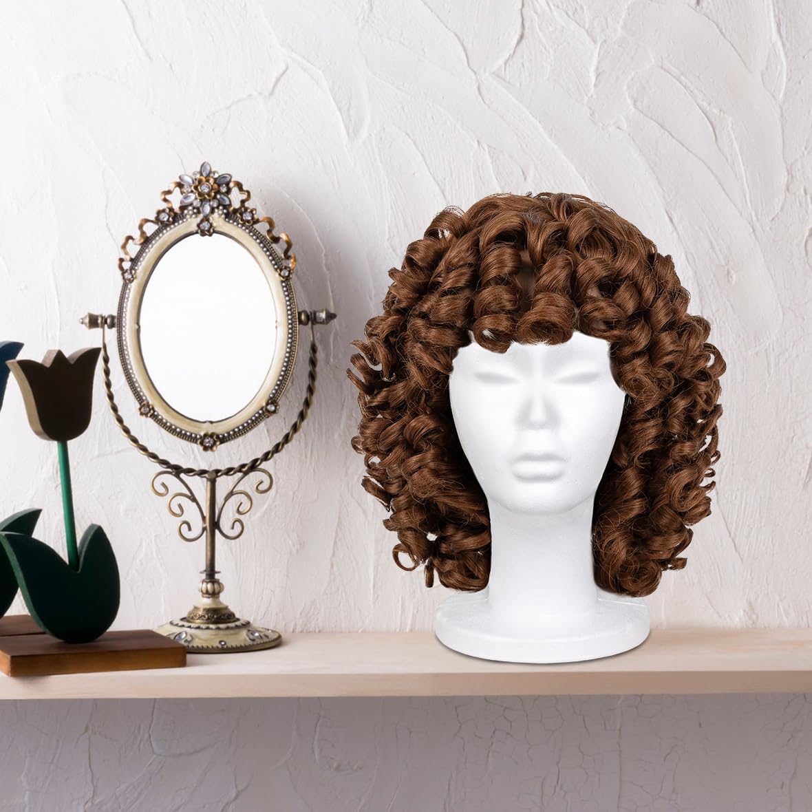 Leeven wig mounted on foam head while styling to demonstrate hands-free work