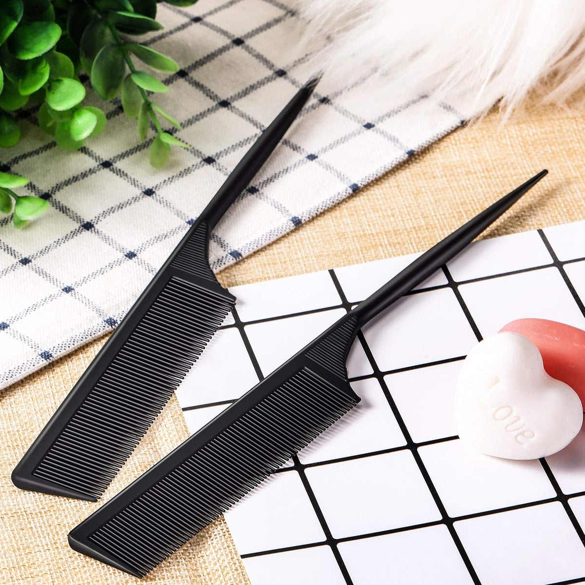 Leinuosen comb held in hand showing compact size for comfortable professional use