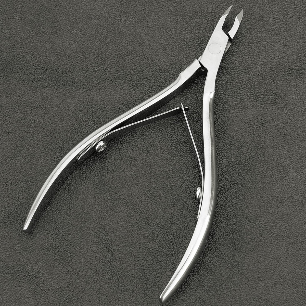 LePinko trimmer in use removing dead skin near fingernail for neat results