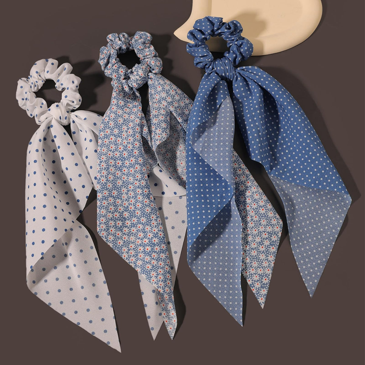 LFOUVRE knotted bow detail on scrunchie highlighting secure hold and decorative flair