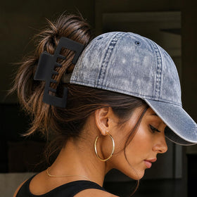 Liayozl in-hat demonstration securing hair under trucker hat for comfort