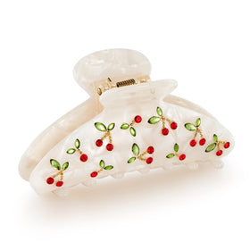 LILIE&WHITE front view of red cherry clip showing shape and sparkle benefit