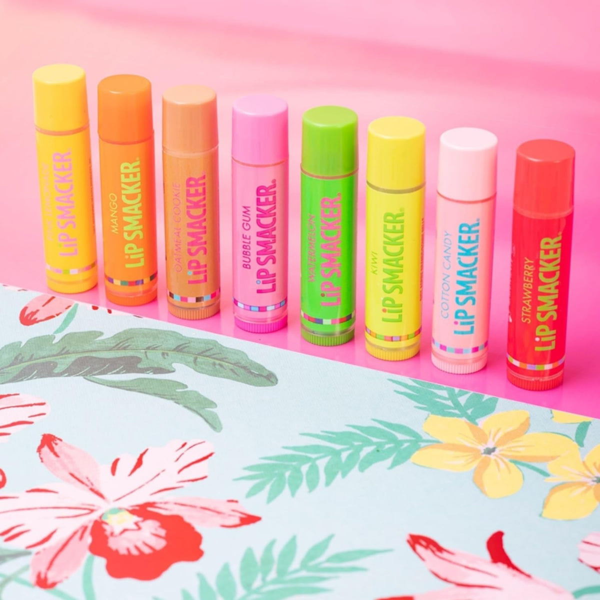 Eight Lip Smacker tubes arranged to display individual flavor labels and variety