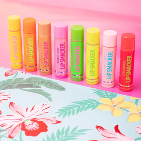 Eight Lip Smacker tubes arranged to display individual flavor labels and variety