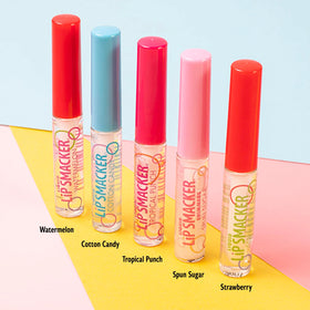Lip Smacker gloss tubes laid out to display assorted shades and finishes