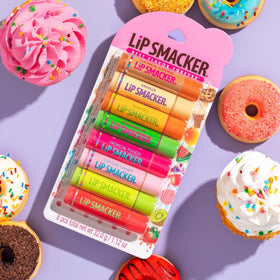 Hand holding Lip Smacker tube to show size and pocket-friendly portability