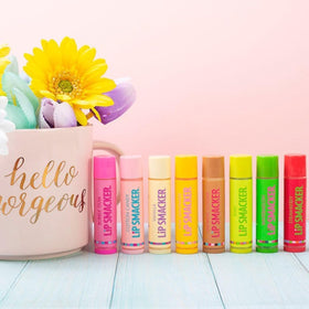 Lifestyle scene with Lip Smacker tubes on a vanity adding fun, flavorful shine