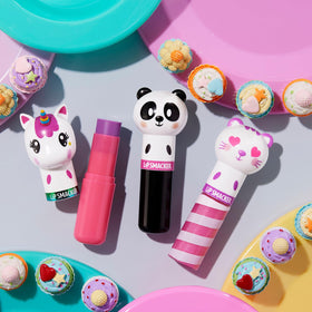 Lip Smacker on vanity with flowers to show playful, collectable appeal
