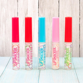 Lip Smacker pack next to coin showing compact travel-friendly size