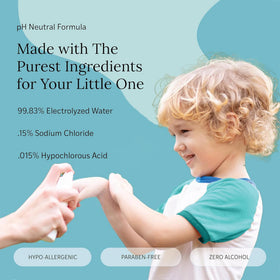 LITTLEY being sprayed on a toddler's hands outdoors for quick cleaning
