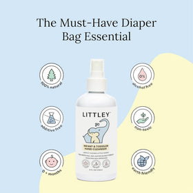 LITTLEY bottle beside a diaper bag illustrating compact travel size