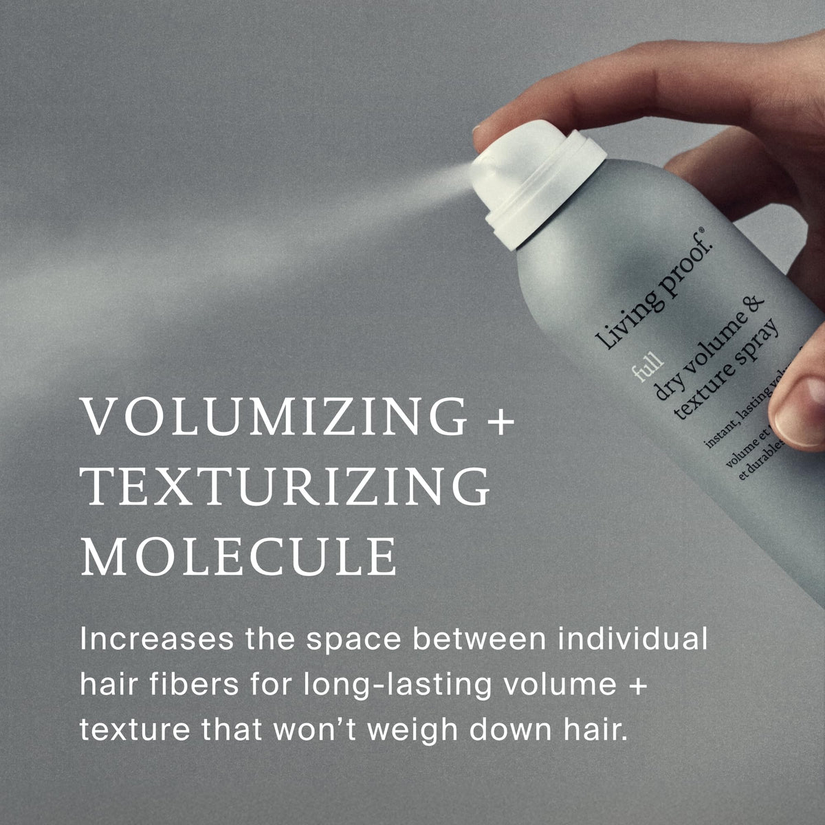 Living Proof bottle near styling tools suggesting heat protection up to 410°F/210°C benefit
