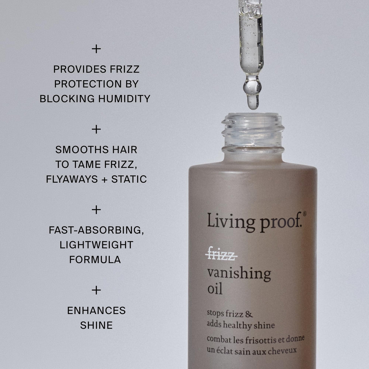 Living Proof oil being rubbed between hands for even application