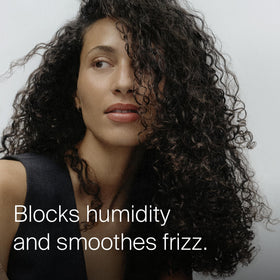Living Proof oil texture on skin showing lightweight, fast-absorbing look